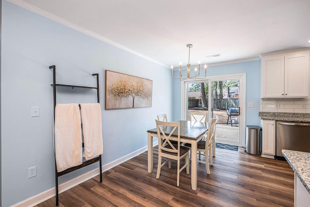 dining room with a chandelier, dark wood-style flooring, ornamental molding, and baseboards