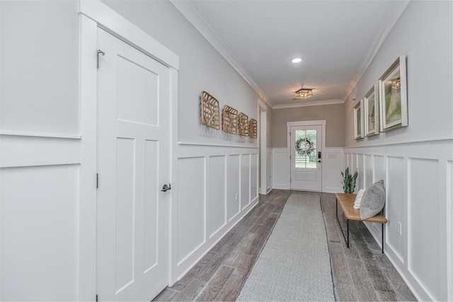 doorway to outside featuring crown molding