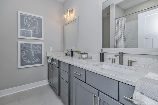 bathroom with tile patterned flooring, vanity, and walk in shower