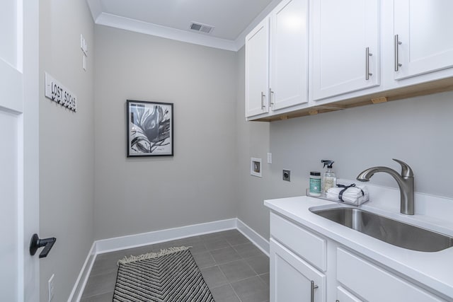 washroom featuring cabinets, crown molding, sink, hookup for a washing machine, and hookup for an electric dryer