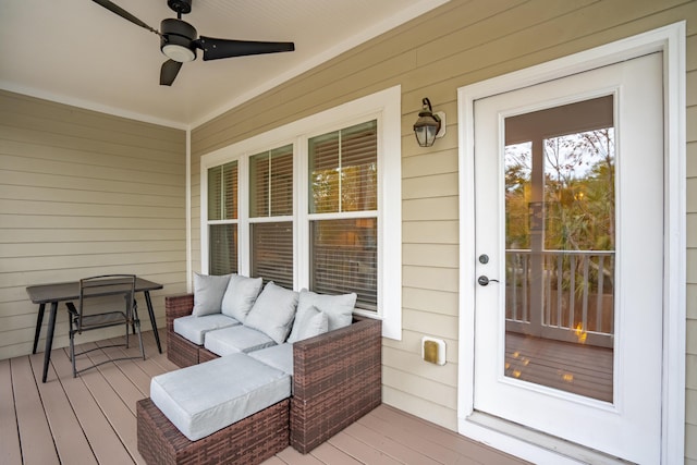 wooden terrace with a porch and ceiling fan