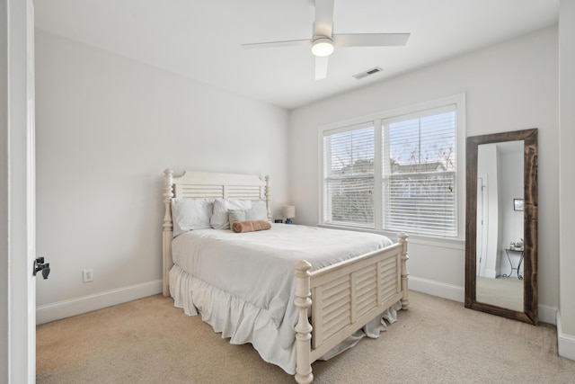 bedroom featuring ceiling fan and light carpet