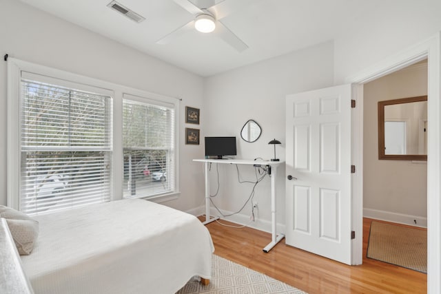 bedroom featuring wood-type flooring and ceiling fan