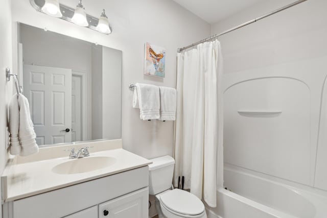 full bathroom with vanity, toilet, and shower / bath combo