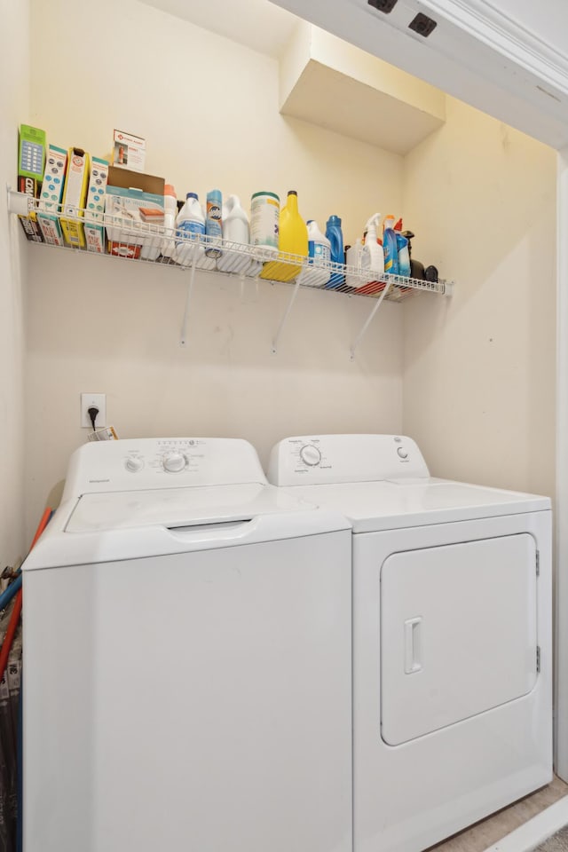 washroom with separate washer and dryer