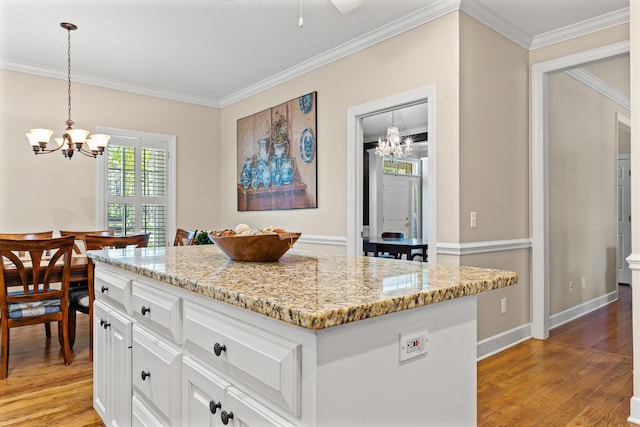 1096 Dunham Rd, Orangeburg, SC 29118 - kitchen with an inviting chandelier, ornamental molding, white cabinetry, and light wood-type flooring