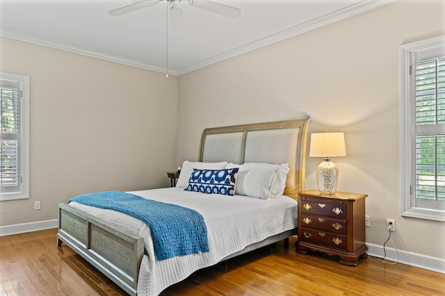 1096 Dunham Rd, Orangeburg, SC 29118 - bedroom with baseboards, ceiling fan, crown molding, and wood finished floors