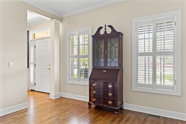 1096 Dunham Rd, Orangeburg, SC 29118 - foyer entrance featuring crown molding, wood finished floors, visible vents, and baseboards