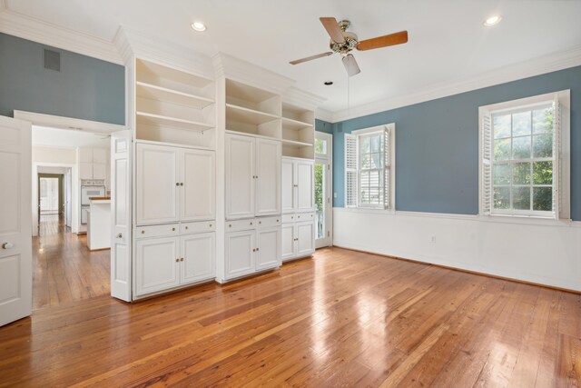 unfurnished bedroom featuring ornamental molding, ceiling fan, and light hardwood / wood-style floors