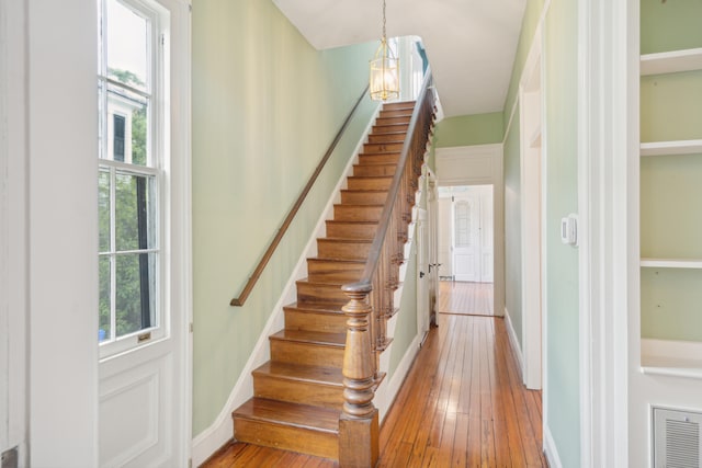 stairway featuring wood-type flooring