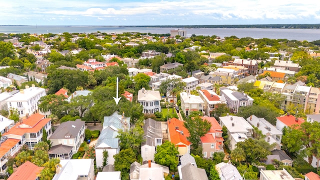 birds eye view of property featuring a water view