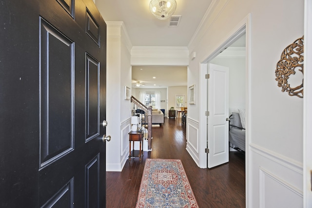 310 Silent Bluff Dr, Summerville, SC 29486 - entrance foyer featuring visible vents, dark wood-style floors, stairway, crown molding, and a decorative wall