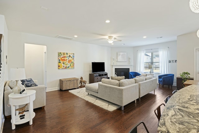 310 Silent Bluff Dr, Summerville, SC 29486 - living area featuring dark wood-style flooring, a glass covered fireplace, visible vents, and recessed lighting