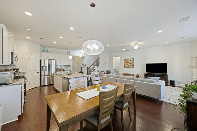310 Silent Bluff Dr, Summerville, SC 29486 - dining space with stairs, dark wood-type flooring, visible vents, and recessed lighting