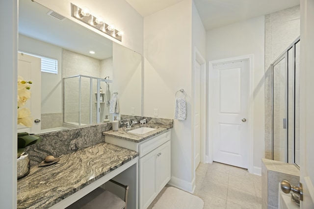 310 Silent Bluff Dr, Summerville, SC 29486 - full bathroom featuring visible vents, baseboards, tile patterned floors, vanity, and a shower stall