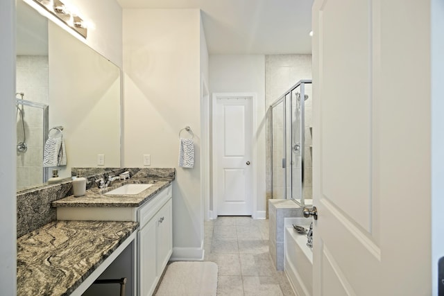 310 Silent Bluff Dr, Summerville, SC 29486 - bathroom with a stall shower, tile patterned floors, baseboards, and vanity