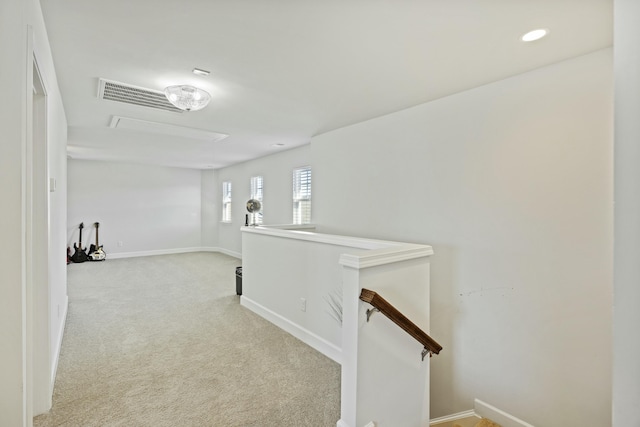310 Silent Bluff Dr, Summerville, SC 29486 - hallway featuring light carpet, attic access, visible vents, baseboards, and an upstairs landing