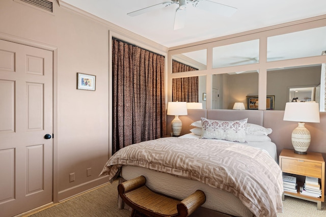 bedroom featuring carpet flooring, a ceiling fan, baseboards, and visible vents