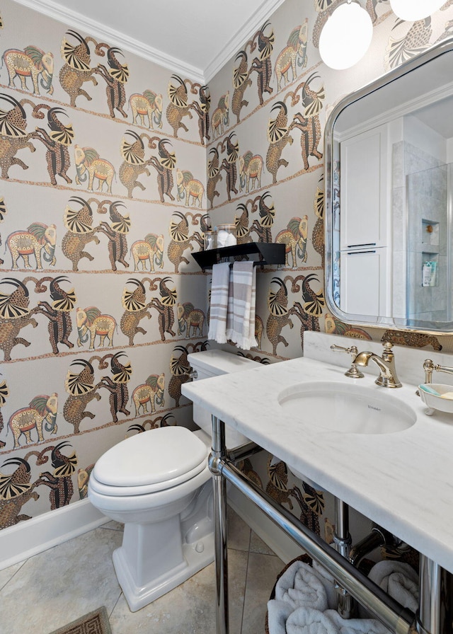 bathroom featuring crown molding, toilet, and vanity