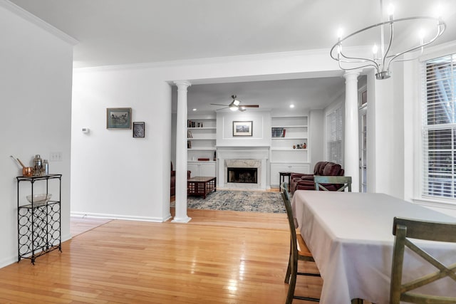 200 Oak Point Landing Dr, Mount Pleasant, SC 29464 - dining space featuring a ceiling fan, light wood finished floors, ornamental molding, baseboards, and ornate columns