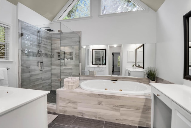 200 Oak Point Landing Dr, Mount Pleasant, SC 29464 - full bathroom featuring vanity, vaulted ceiling, a shower stall, a whirlpool tub, and healthy amount of natural light