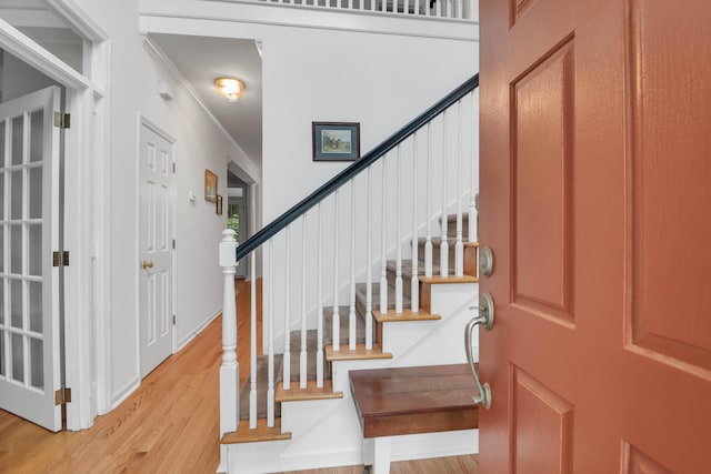 200 Oak Point Landing Dr, Mount Pleasant, SC 29464 - foyer entrance with light wood-style floors, ornamental molding, and stairway