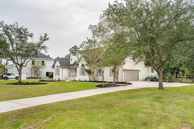 view of front facade with a garage and a front yard