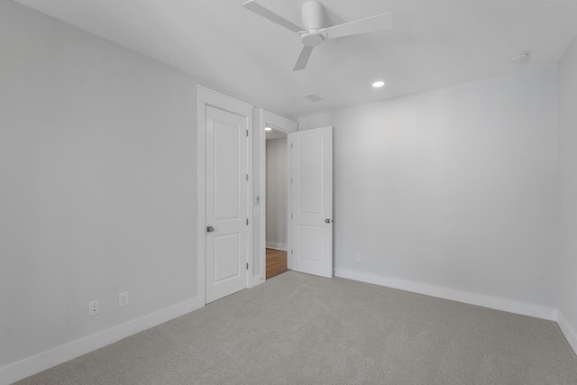 spare room with carpet floors, recessed lighting, baseboards, and a ceiling fan