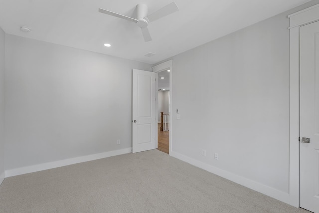 empty room with a ceiling fan, baseboards, carpet flooring, and recessed lighting