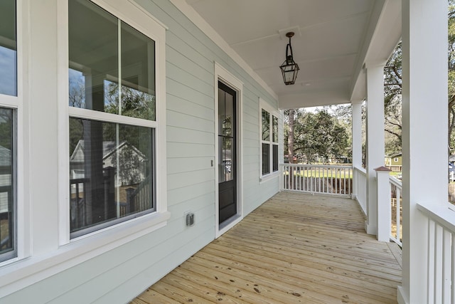 wooden terrace with a porch