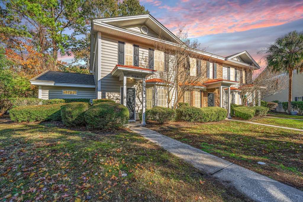 view of front of home with a yard