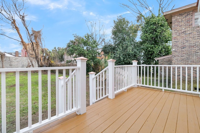 deck featuring a lawn