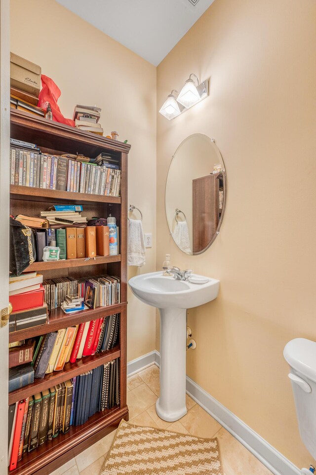 bathroom with tile patterned flooring and toilet