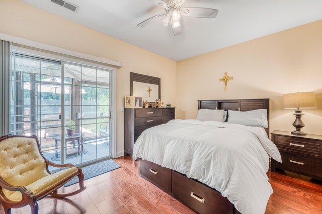 bedroom with ceiling fan, hardwood / wood-style flooring, and access to outside