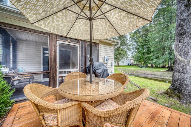 wooden deck featuring a yard