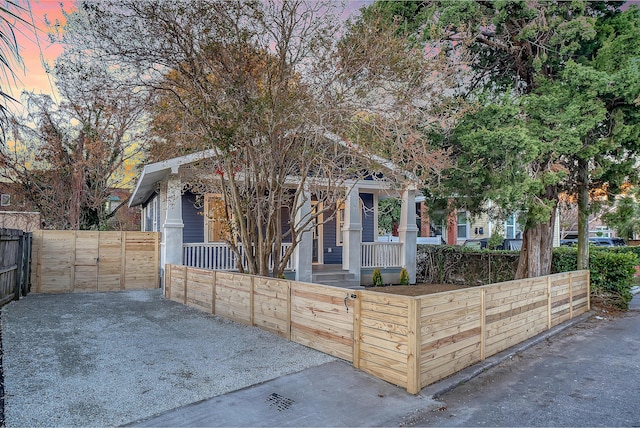 obstructed view of property with covered porch