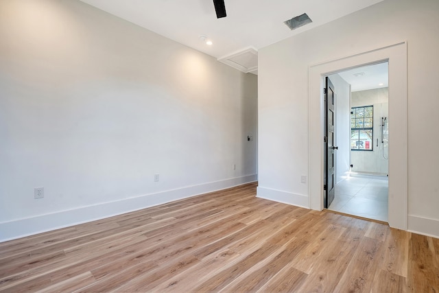 unfurnished room with light hardwood / wood-style floors