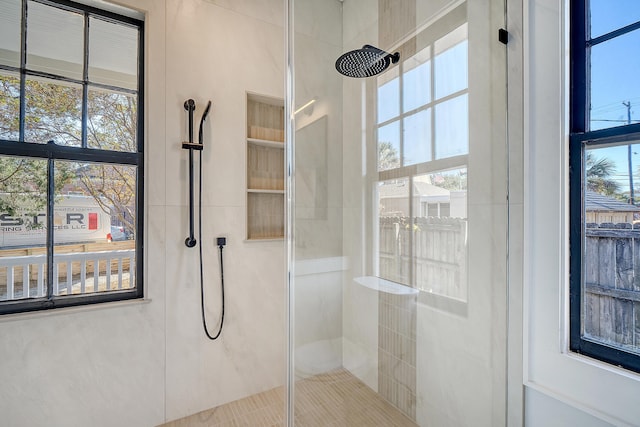 bathroom with tiled shower