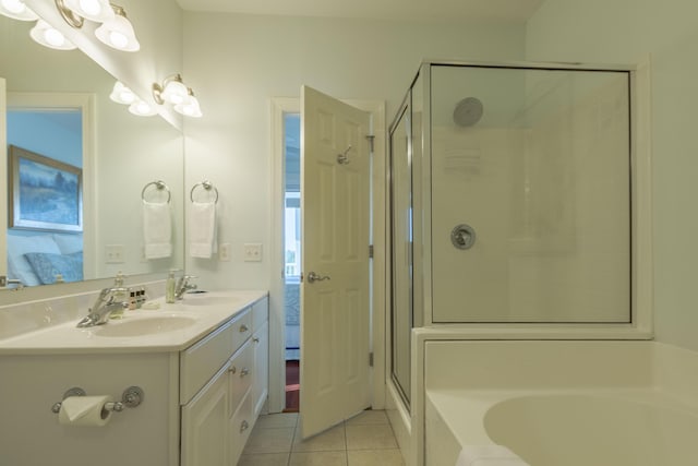 204 Michigan Avenue C-5 - Unit 11, Folly Beach, SC 29439 - bathroom with ensuite bath, a bath, a shower stall, double vanity, and tile patterned floors