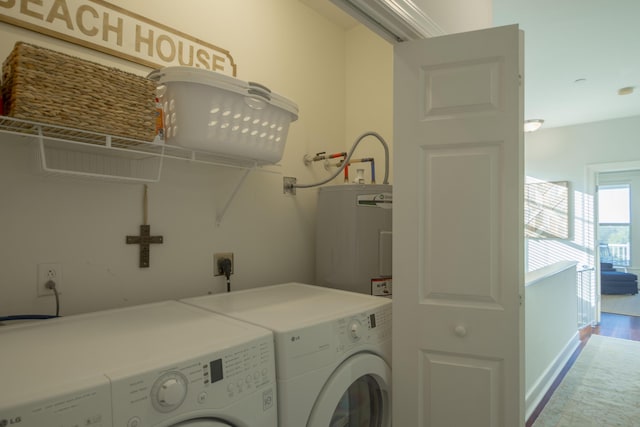 204 Michigan Avenue C-5 - Unit 11, Folly Beach, SC 29439 - laundry area featuring electric water heater and separate washer and dryer
