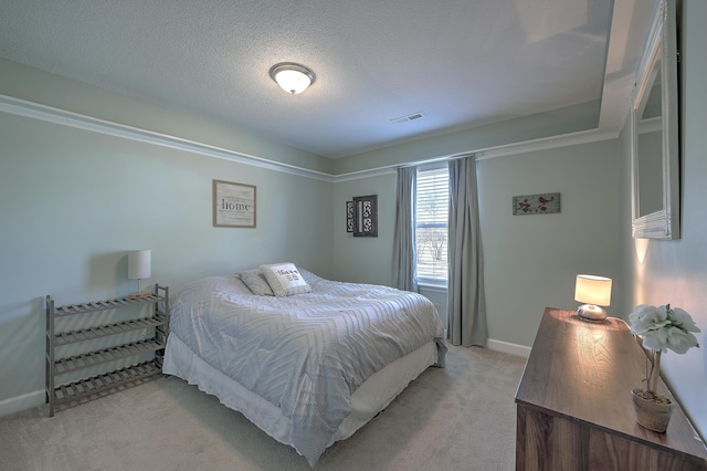 carpeted bedroom featuring a textured ceiling