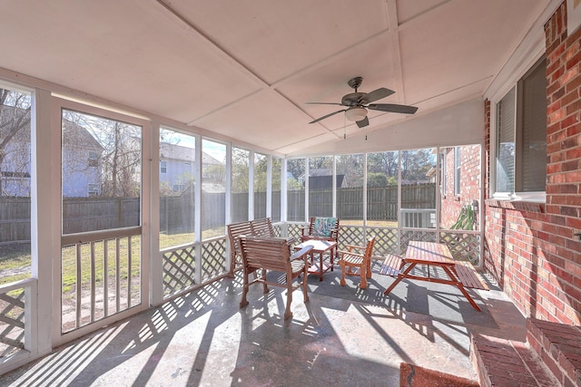 sunroom / solarium with plenty of natural light and ceiling fan