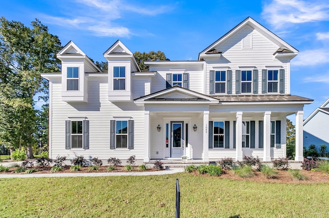 view of front of house with a front yard and a porch