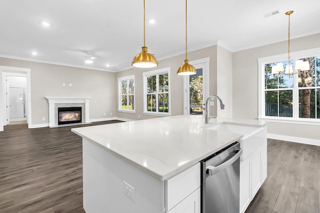 kitchen with sink, white cabinetry, hanging light fixtures, a center island with sink, and stainless steel dishwasher