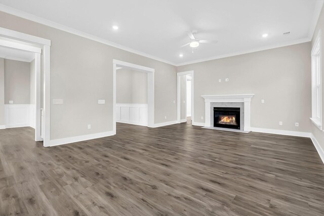 unfurnished living room with ceiling fan, ornamental molding, dark hardwood / wood-style floors, and a high end fireplace