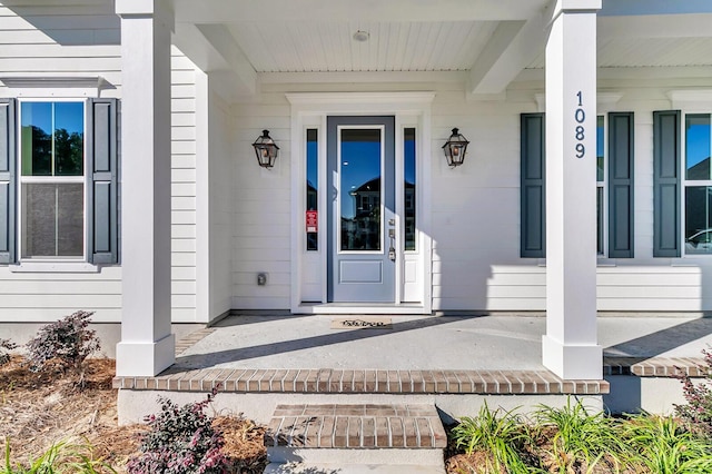 entrance to property with covered porch