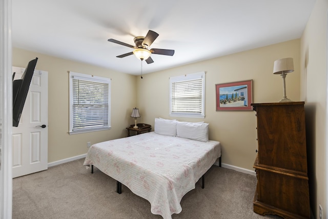 bedroom featuring light carpet and ceiling fan