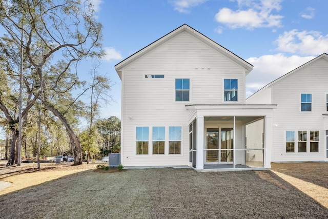 rear view of property with a sunroom