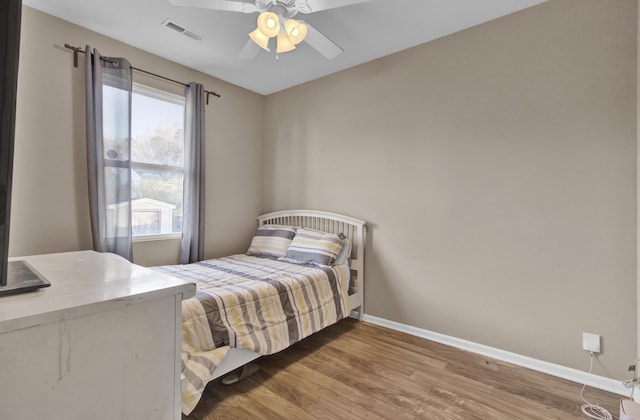 bedroom featuring ceiling fan and hardwood / wood-style floors