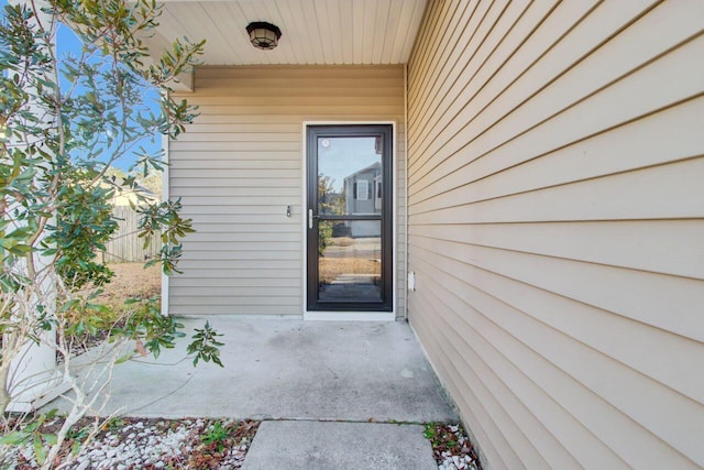 property entrance with a patio area